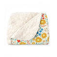 Load image into Gallery viewer, Floral-patterned blanket with white sherpa lining on a white background