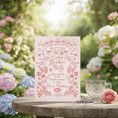 Load image into Gallery viewer, Invitation card for a garden party with floral design on a wooden table outdoors.