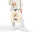 Load image into Gallery viewer, Person holding a tote bag with butterfly design on a white background
