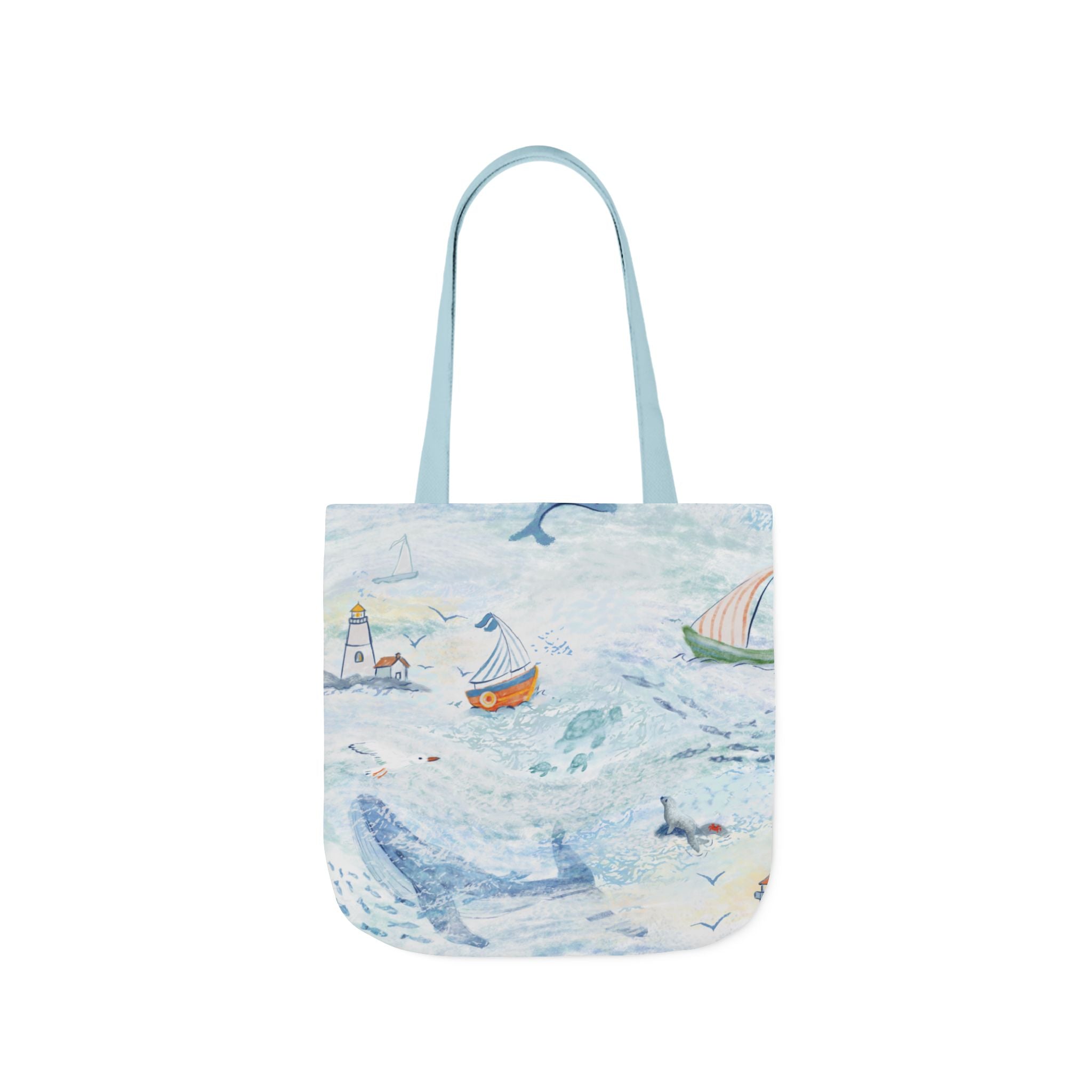 Tote bag with a coastal design featuring boats and a lighthouse on a white background