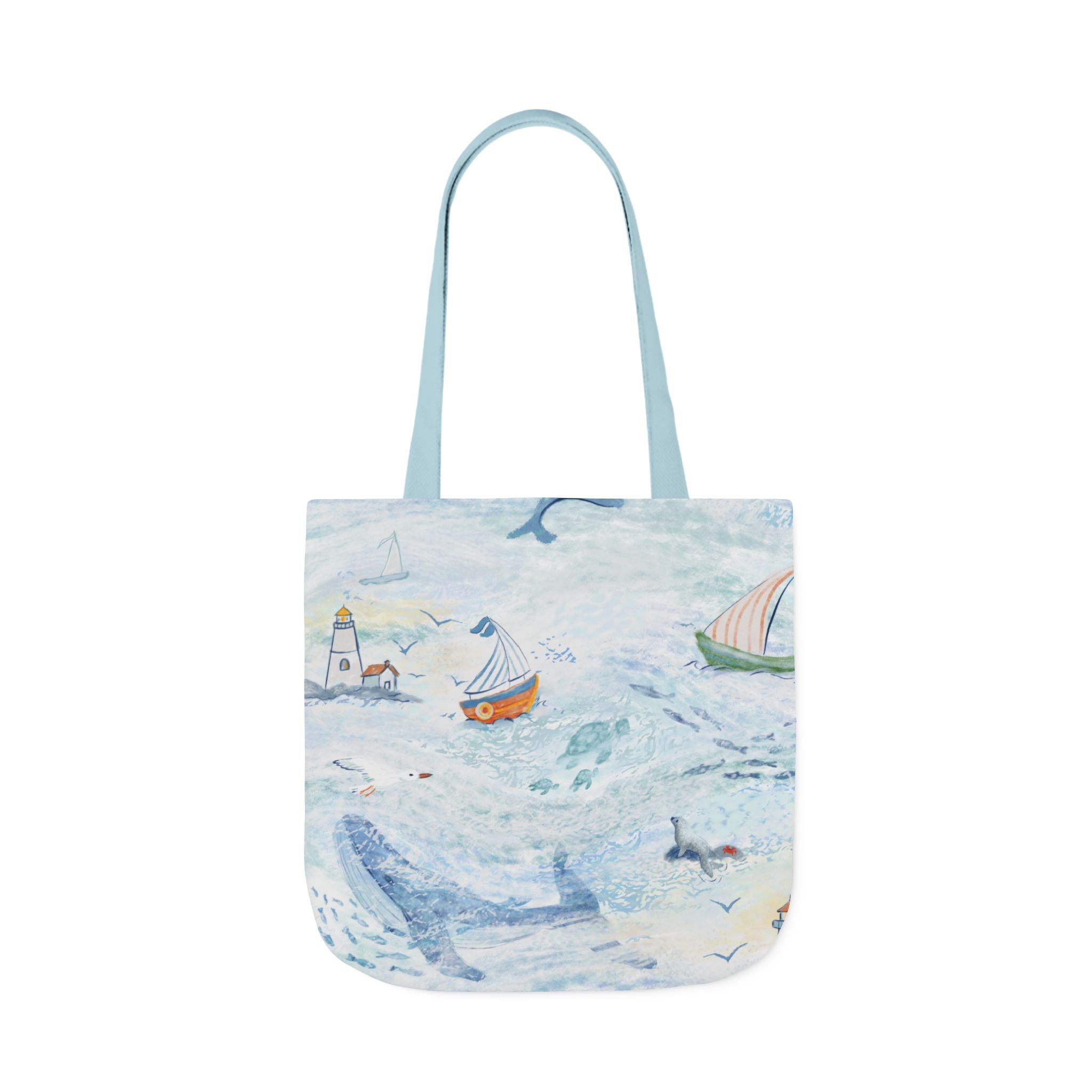 Tote bag with a coastal design featuring boats and a lighthouse on a white background