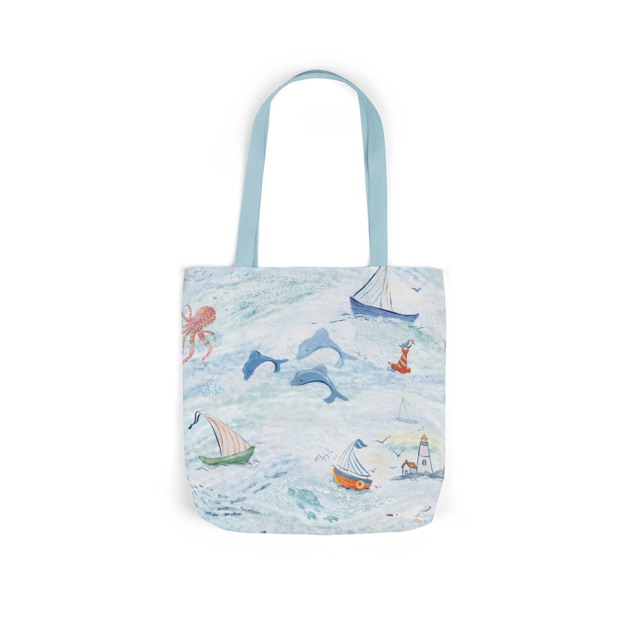 Tote bag with ocean-themed design featuring boats and dolphins on a white background