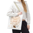 Load image into Gallery viewer, Person wearing a white hoodie with a Sagittarius-themed tote bag.
