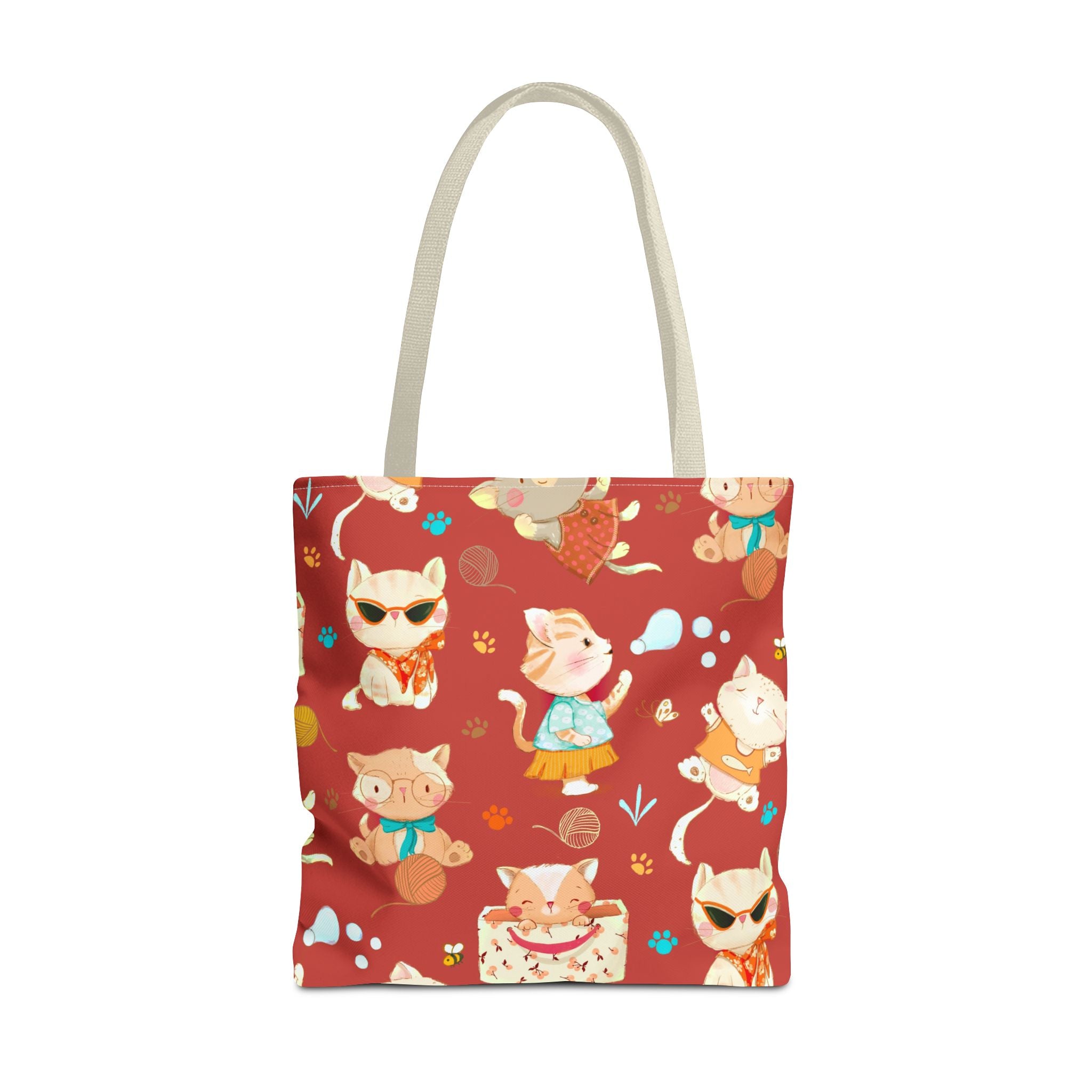 Tote bag with cartoon cat design on a red background
