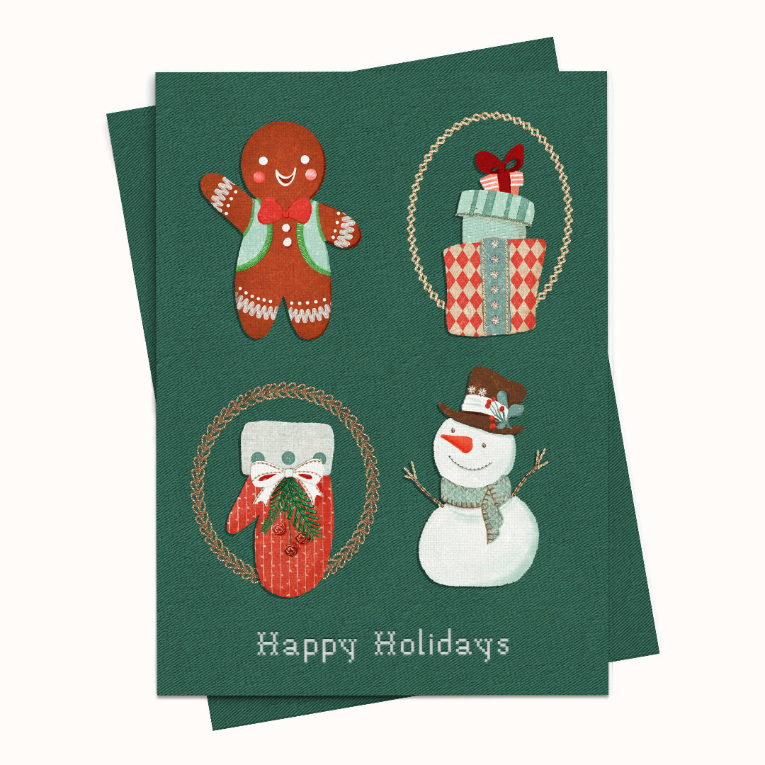 A dark green holiday greeting card featuring four festive illustrations: a gingerbread man, wrapped gifts, a snowman, and a cat in a sweater, with the text 'Happy Holidays' at the bottom. A second card is partially visible behind it on a light beige background.