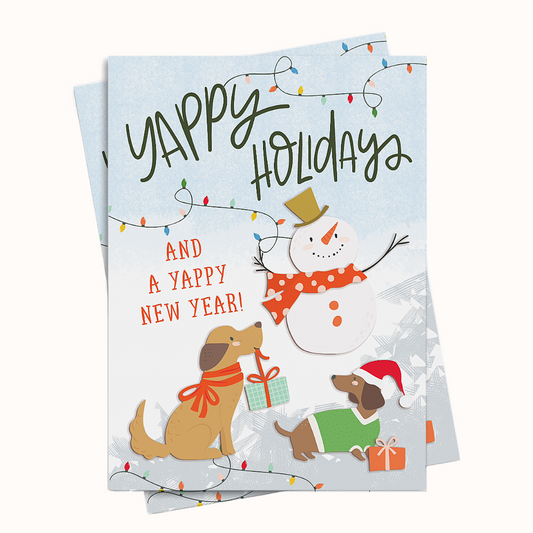 Holiday card with snowman, dogs, and Christmas lights on a white background for dog lovers