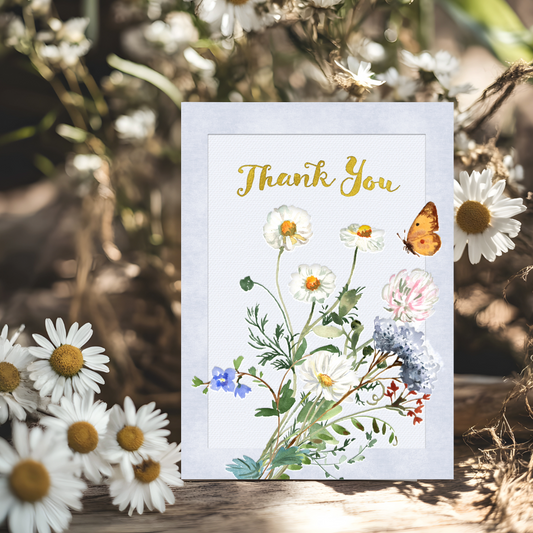 Card with floral design and 'Thank You' text, surrounded by daisies and a butterfly.